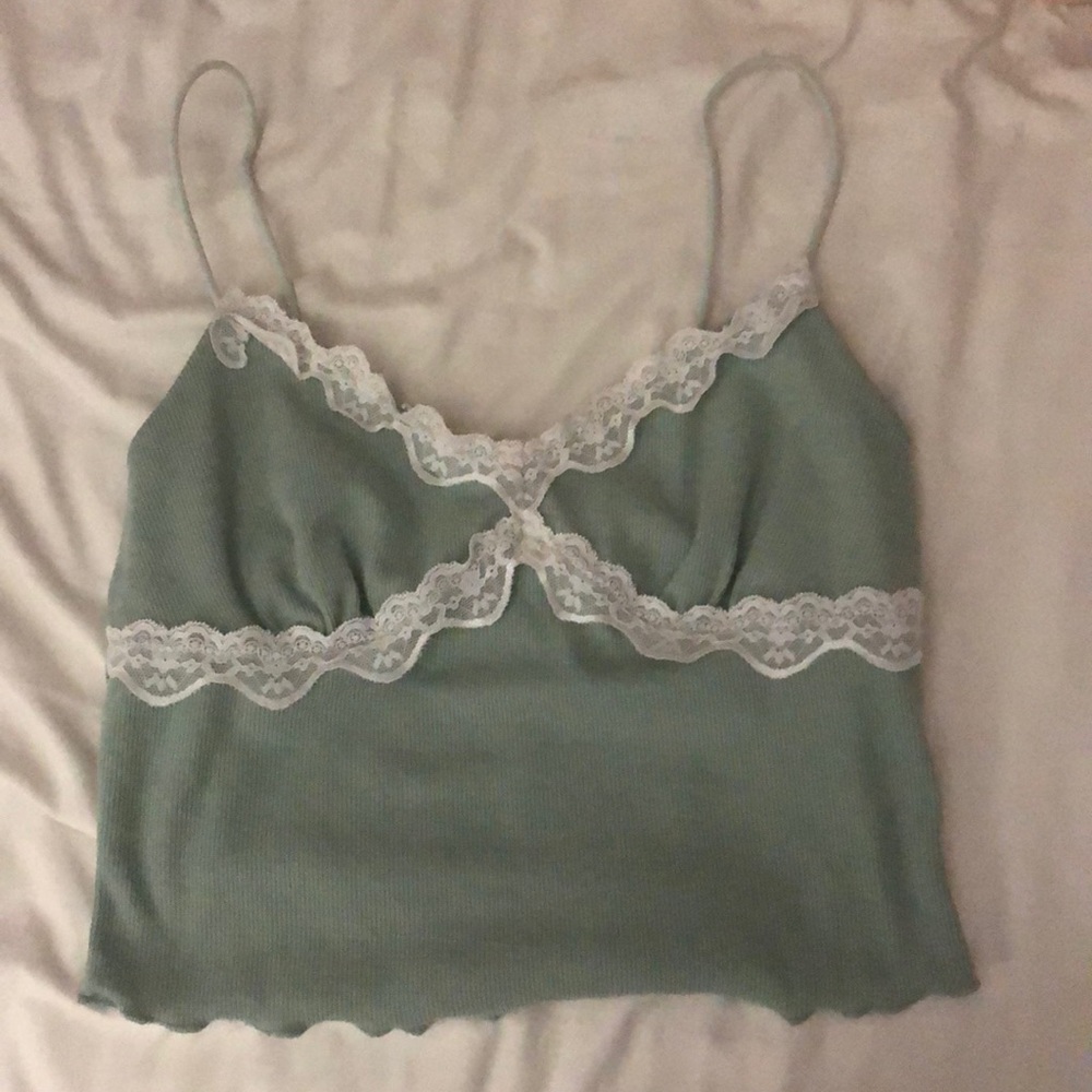 Green tank top with floral pattern.